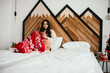 Fashionable woman in a cozy room in Christmas mood