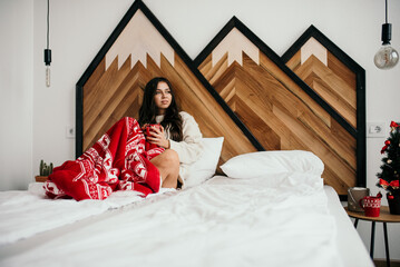 Poster - Fashionable woman in a cozy room in Christmas mood