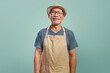 © eggeeggjiew - Portrait of Happy Asian Senior man wearing brown apron smiling looking at camera over isolated color background, Small business owner, Entrepreneur