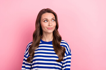 Wall Mural - Portrait of good mood girlish person with curly hairstyle wear striped clothes look at offer empty space isolated on pink color background