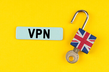 Poster - On the yellow surface is an open lock with a key and a sticker with the inscription - VPN