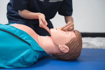 Wall Mural - CPR Training ,Emergency and first aid class on cpr doll, Cardiopulmonary resuscitation, One part of the process resuscitation on unconscious person.