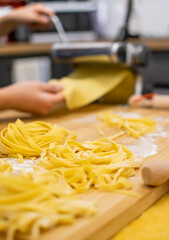 Close up of Pasta and Hands making home made Italian Pasta