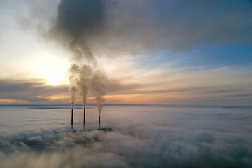 Sticker - Coal power plant high pipes with black smoke moving upwards polluting atmosphere. Production of electrical energy with fossil fuel concept