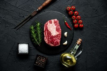 Poster - raw marbled beef steak on stone background