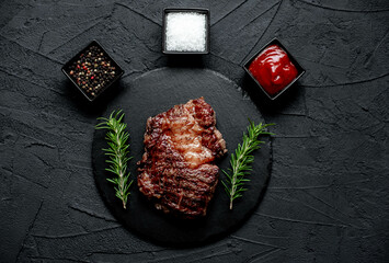 Poster - grilled beef steak on stone background