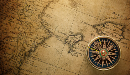 Wall Mural - Magnetic compass on world map. Travel, geography, navigation, tourism and exploration concept background. Macro photo. Very shallow focus.