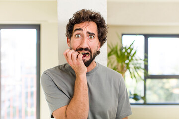 Wall Mural - young adult crazy man with expressive pose at a modern house interior