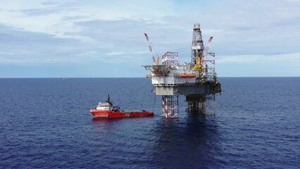 Wall Mural - Aerial view from a drone of an offshore jack up rig at the offshore location during day time
