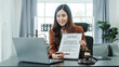 © Phushutter - Explain the details of the contract. Online consulting with laptop in office of asian thai japanese chinese female exclusive lawyer legal advisor, legislation, saleswoman, legal contract documents