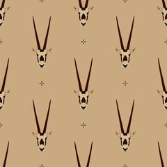 Wall Mural - Seamless animal pattern with horned heads of Oryx antelope. Scimitar oryx. Oryx dammah. On beige background.