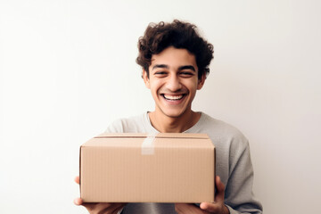 Smiling young man holding a cardboard box, with a white background, high quality generative ai