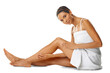 Legs, portrait and woman skincare isolated on a transparent, png background for shower hair removal results and self care. Beauty, body and biracial person or model relax on floor for dermatology