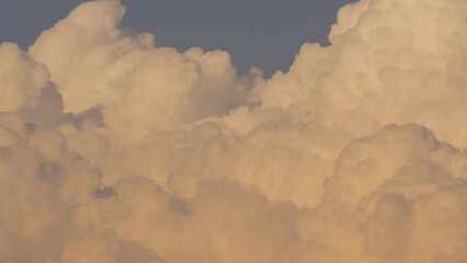 Wall Mural - Cloud closeup Time lapse video. Large, detailed clouds captured from a distance with high-quality cameras and lenses.
