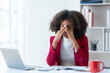 © Premreuthai - Businesswoman curly hair stressed with overwork in the office.