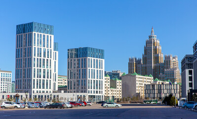 Modern high-rise buildings and an empire style house on a sunny day. Astana. Republic of Kazakhstan