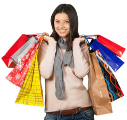 Wall Mural - Young woman with shopping bags on  background