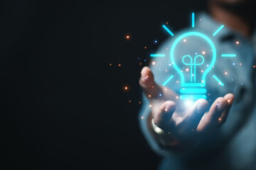 creativity new ideas and innovations hand holding light bulb and technology brain
