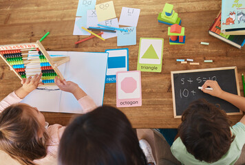 Poster - Learning, education and study with family at table from above for homework, home schooling and child development. Math, lesson and creative with children and woman for knowledge, help and support