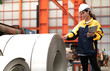 © Nassorn - Latin engineer wears safety helmet work in heavy metal engineering factory. Young female hispanic worker in hardhat hard hat checking production machinery equipment in metalwork manufacturing facility