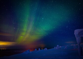 Wall Mural - Aurora Borealis Known as Norther Lights Playing with Vivid Colors Over Lofoten Islands in Norway.