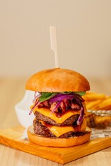 Poster - Appetizing shot of a classic hamburger served on a cutting board