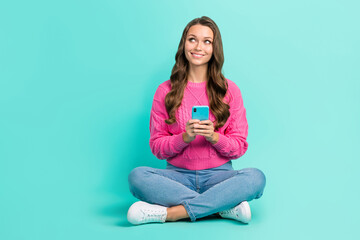 Sticker - Full length photo of dreamy cute girl wear pink sweater texting twitter telegram facebook empty space isolated turquoise color background