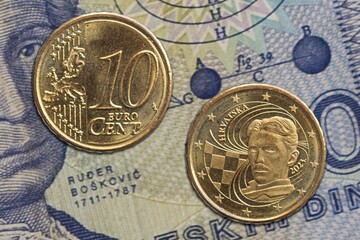 Closeup of two Croatian Euro coins on a cash bill