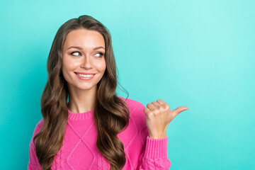 Poster - Portrait of cheerful stunning pretty lady wear trendy pink clothes thumb presenting nice offer isolated on cyan color background