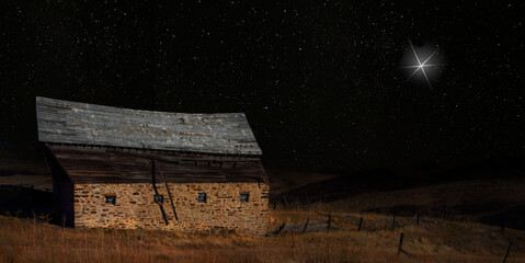 Wall Mural - christmas star rising over an old abandoned barn
