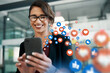 © C Malambo/peopleimages.com - Office, love icon or happy woman with a phone for communication, social media texting or online dating. Like, graphic overlay or relaxed girl on mobile app website or digital network with heart emoji