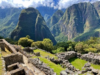 Wall Mural - Landscape of the stunning mountains of Machu Picchu covered in the fog in Peru