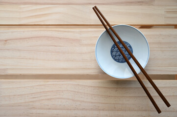 Wooden chopsticks on Japanese style plate oriental light style