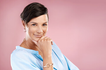 Canvas Print - How you doing. Cropped portrait of an attractive young woman posing in studio against a pink background.