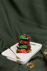 Canvas Print - Vertical shot of freshly-baked creamy cookies on a ceramic tray on the table