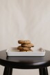 © Jonathan Borba/Wirestock Creators - Vertical shot of freshly-baked chocolate cookies on a ceramic tray on the table