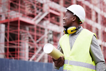 Poster - Everythings on track. a handsome young construction worker standing on a building site.