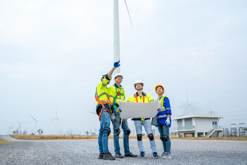Poster - Group of engineers are working with a blueprint in wind turbine farm,Wind power station,Renewable and clean energy concept.