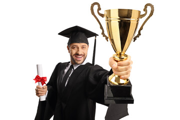 Poster - Full length portrait of a happy young man wearing a graduation gown and holding a gold trophy cup