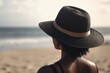 © Deivison - Landscape with black woman with hat, beach and sea in background, bokeh background. Generative AI