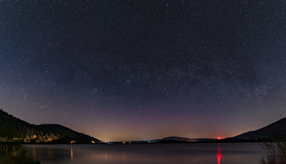 a panoramic night view of the night sky looking over bassenthwaite lake in the english lake district