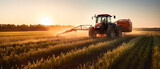 Fototapeta  - Farming tractor spraying plants in a field.