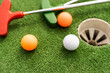 © Angelov - Mini-golf ball on artificial grass. Summer season game