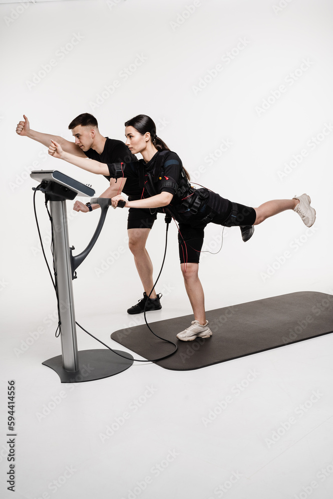 Group workout training in EMS suit, which applies electrical impulses ...