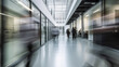 © AIPERA - Busy office  and commercial floor, people walking on a busy office floor, motion blurr