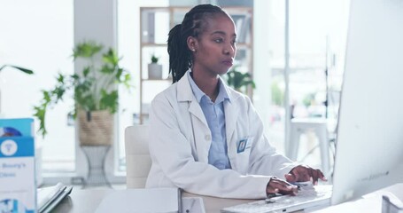 Black woman, doctor and computer for typing, reading or email communication at clinic office. Female african medic, desktop and focus for report, admin or planning at hospital for medical research