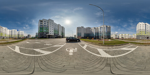 360 hdri panorama view with skyscrapers in new modern residential complex on parking for people with disabilities in equirectangular spherical projection, ready VR virtual reality content