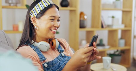 Poster - Asian woman, phone and laughing for funny joke, meme or chat on living room sofa at home. Happy female relaxing on lounge couch with laugh chatting or texting on mobile smartphone app or social media