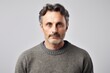 © Robert MEYNER - Portrait of a handsome middle-aged man wearing a grey sweater