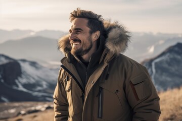 Wall Mural - Full-length portrait photography of a cheerful man in his 30s wearing a warm parka against a mountain landscape background. Generative AI